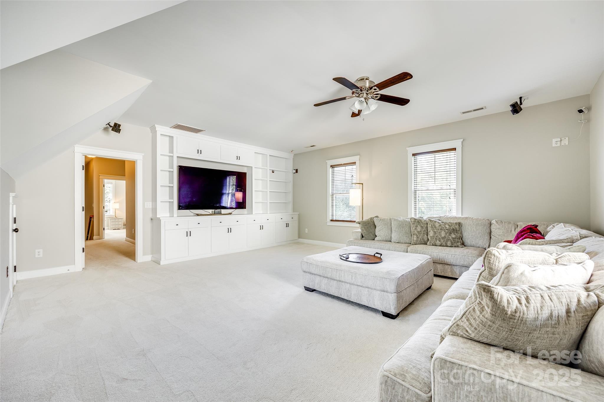 1128 Windsong Bay Lane Fort Mill, SC 29708 - Photo 26 of 35 a living room with furniture and a flat screen tv
