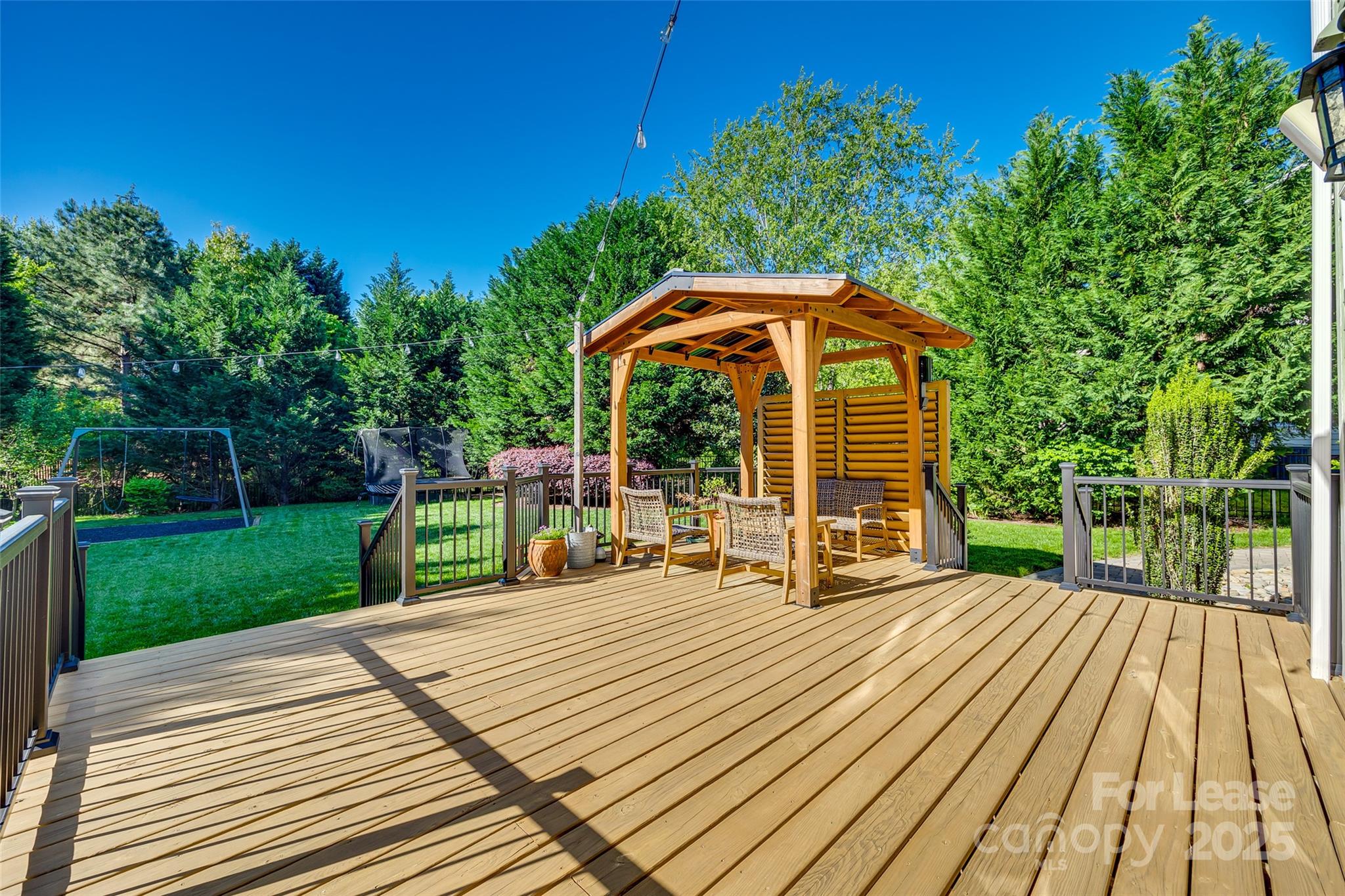 1128 Windsong Bay Lane Fort Mill, SC 29708 - Photo 29 of 35 a view of a chairs and table on the wooden deck