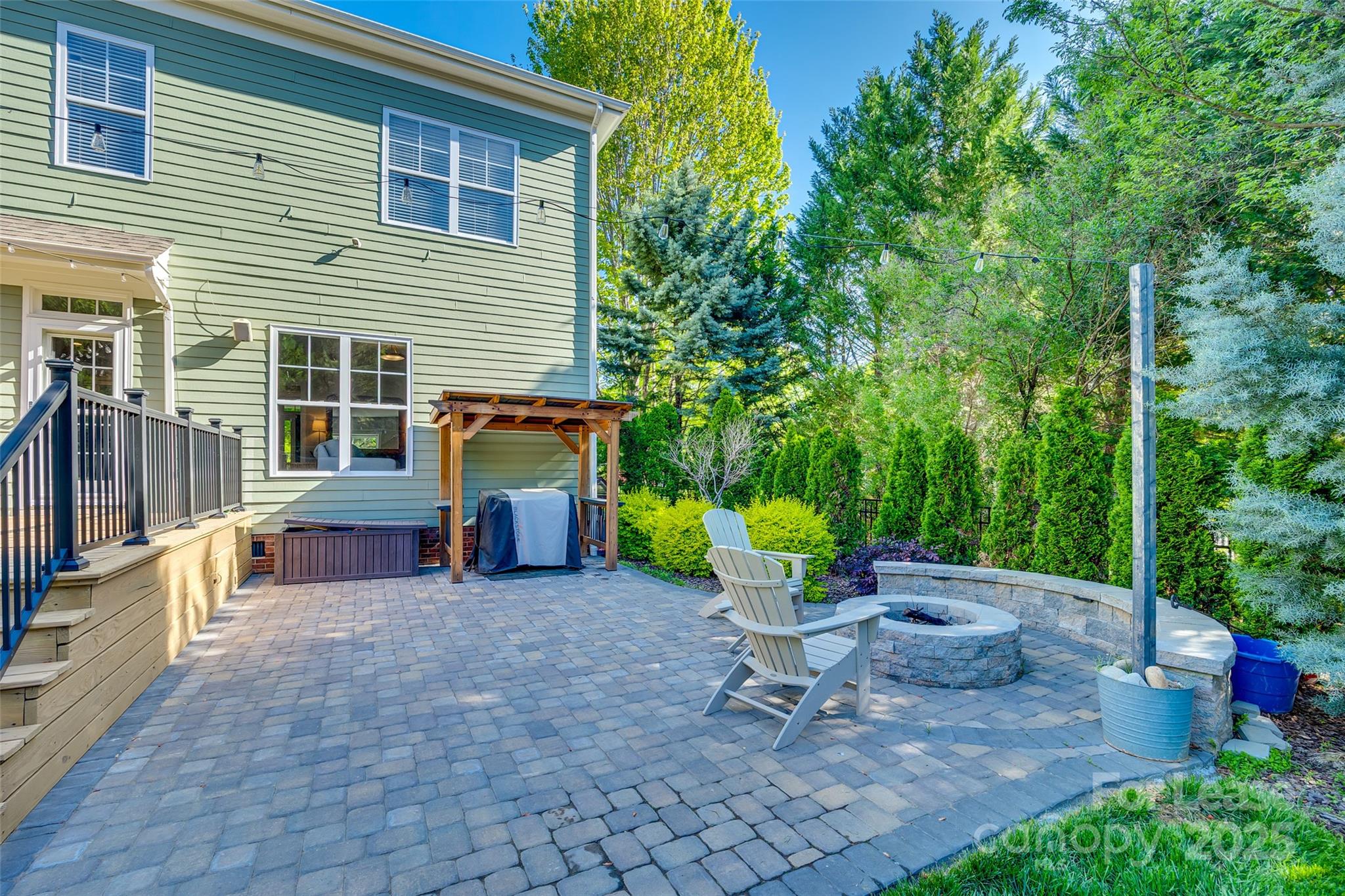 1128 Windsong Bay Lane Fort Mill, SC 29708 - Photo 31 of 35 a view of a chairs and table in the back yard of the house