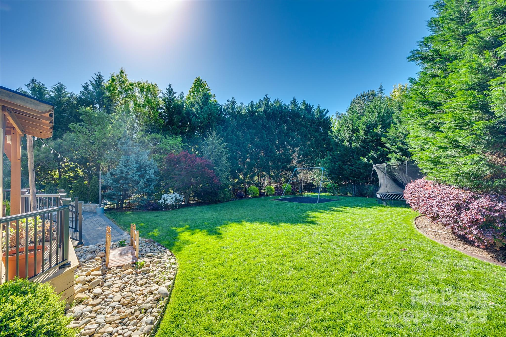 1128 Windsong Bay Lane Fort Mill, SC 29708 - Photo 34 of 35 a view of a backyard with table and chairs and potted plants and big yard