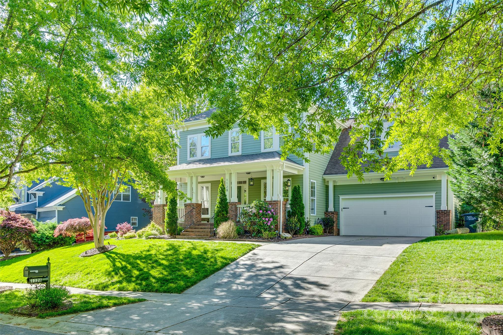 1128 Windsong Bay Lane Fort Mill, SC 29708 - Photo 35 of 35 a front view of a house with a garden and plants