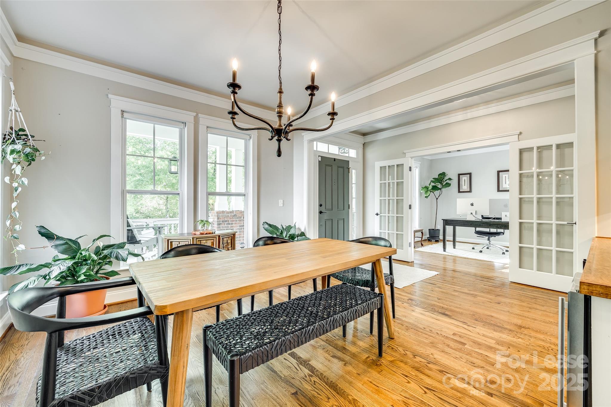 1128 Windsong Bay Lane Fort Mill, SC 29708 - Photo 5 of 35 a view of a dining room with furniture window and wooden floor