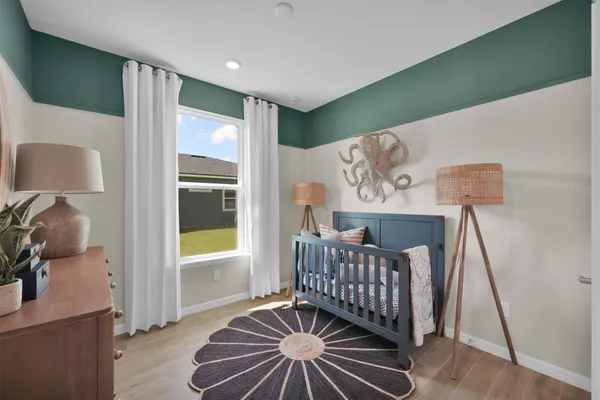 a bedroom with bed and a window
