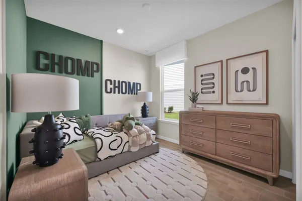 a bedroom with furniture and a window