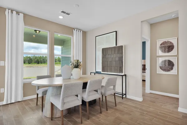 a kitchen with sink stove and living room