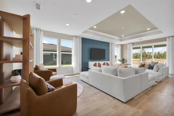 a view of a dining room with furniture window and wooden floor
