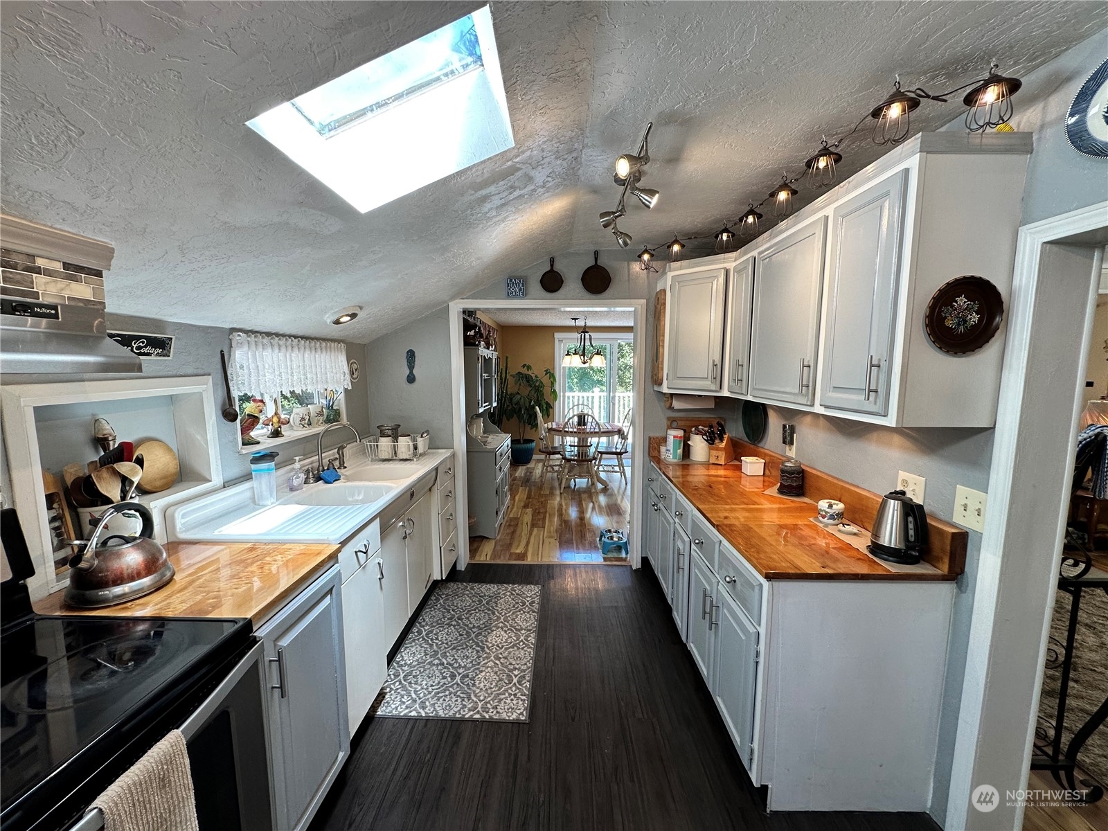 732 Gasman Road Port Angeles, WA 98362 - Photo 11 of 35 a large kitchen with stainless steel appliances granite countertop a stove and a sink