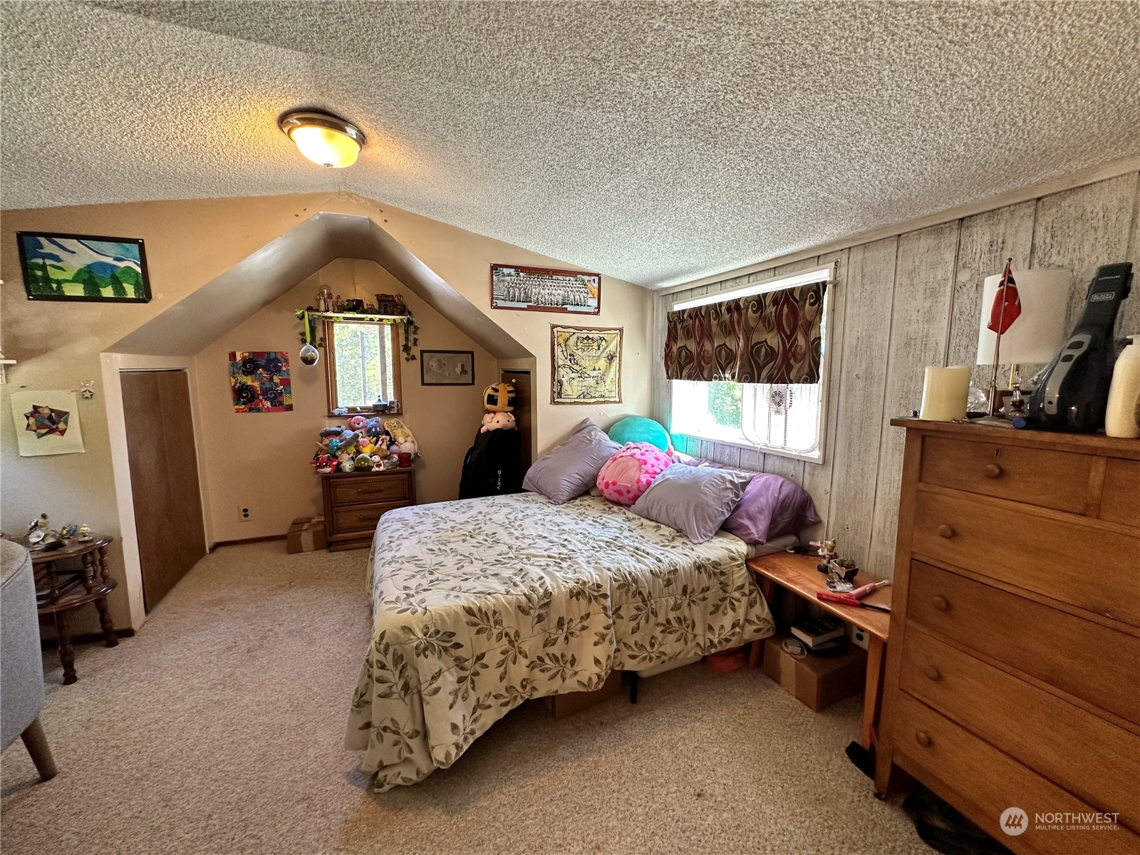 732 Gasman Road Port Angeles, WA 98362 - Photo 14 of 35 a bedroom with a bed and a dresser in it