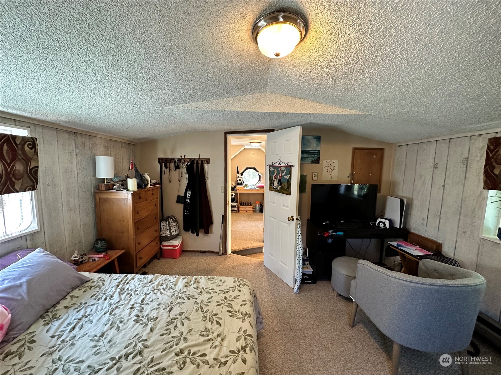732 Gasman Road Port Angeles, WA 98362 - Photo 15 of 35 a bed room with a bed and a couch