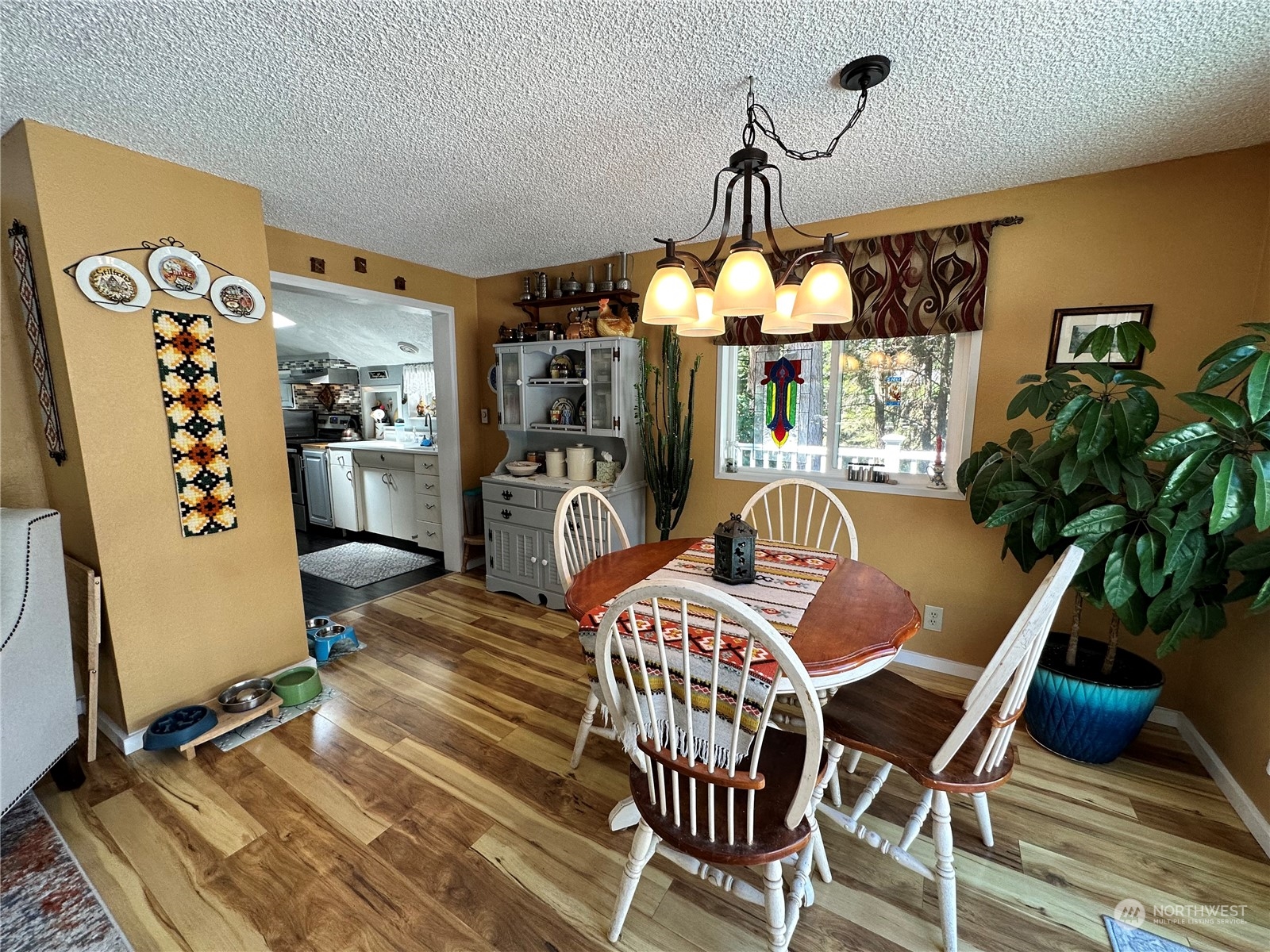 732 Gasman Road Port Angeles, WA 98362 - Photo 9 of 35 a view of a dining room with furniture and chandelier