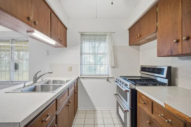 a kitchen that has a sink and a stove