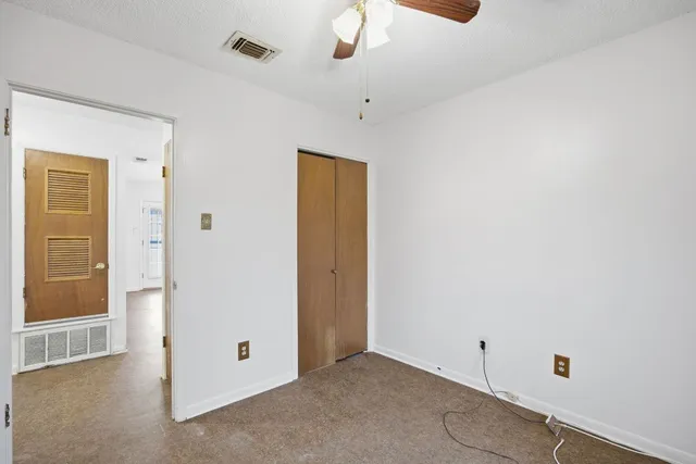 a bathroom with a sink toilet and mirror