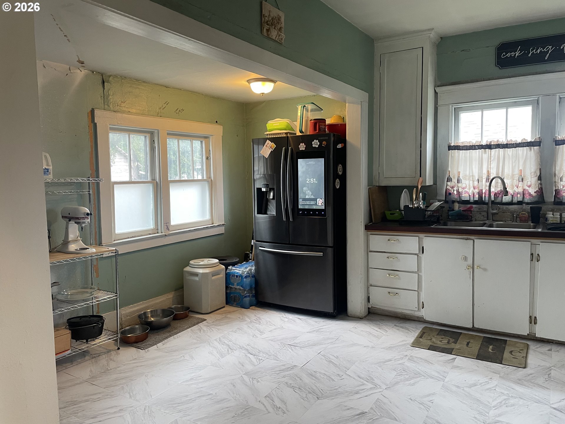 1006 5th Street Springfield, OR 97477 - Photo 12 of 43 a kitchen with a refrigerator and windows