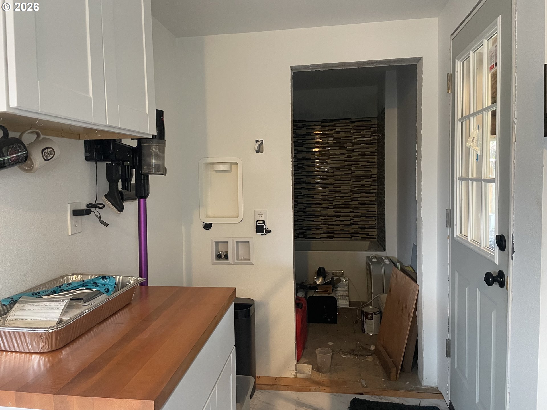 1006 5th Street Springfield, OR 97477 - Photo 19 of 43 a bathroom with a granite countertop sink a toilet and shower