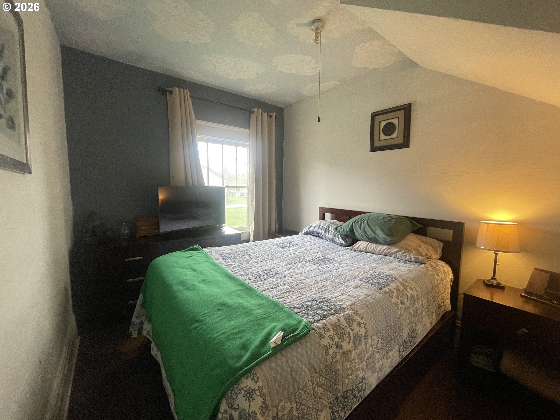 1006 5th Street Springfield, OR 97477 - Photo 27 of 43 a bedroom with a bed and window