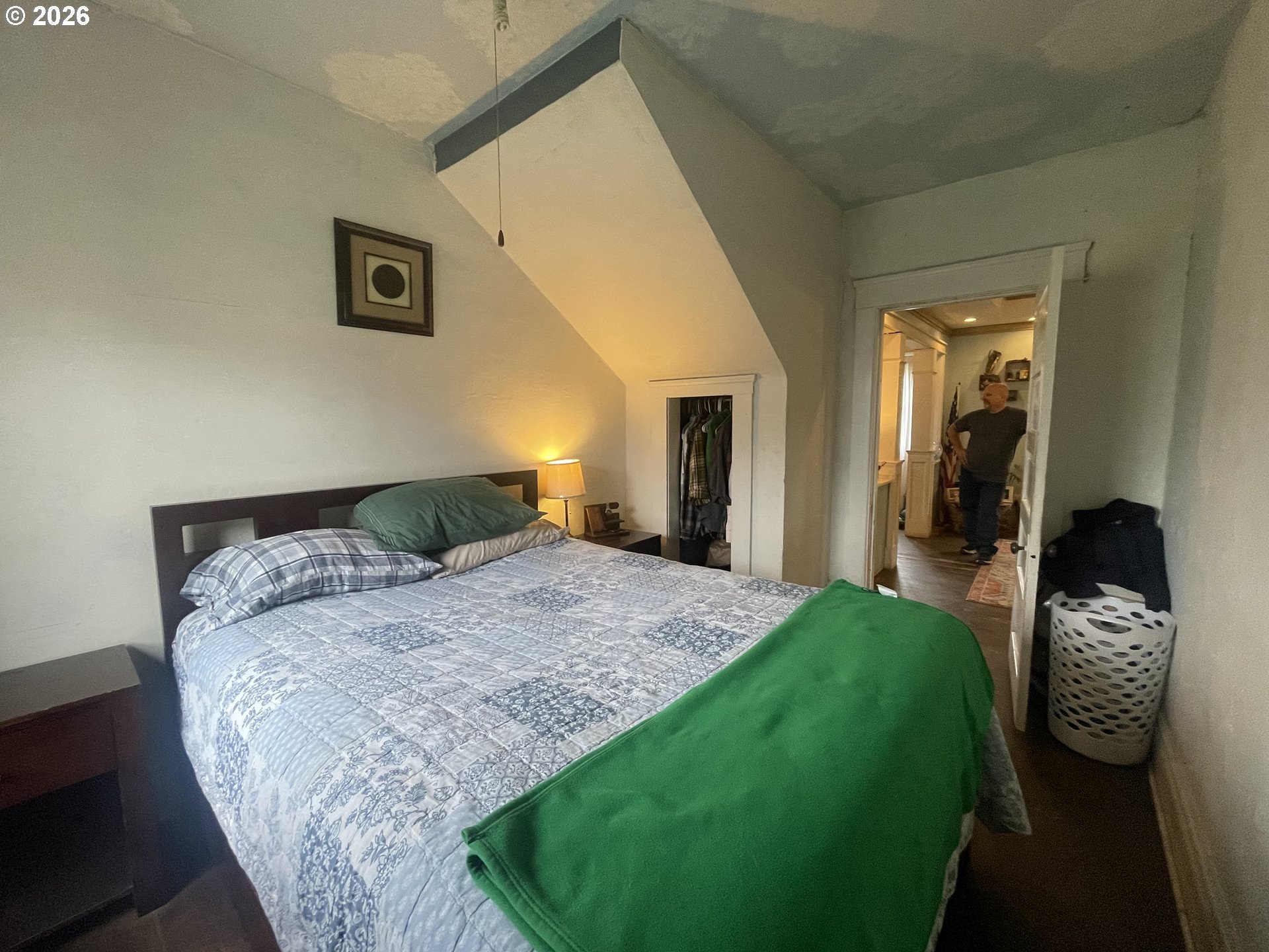 1006 5th Street Springfield, OR 97477 - Photo 28 of 43 a bedroom with a bed and a large mirror