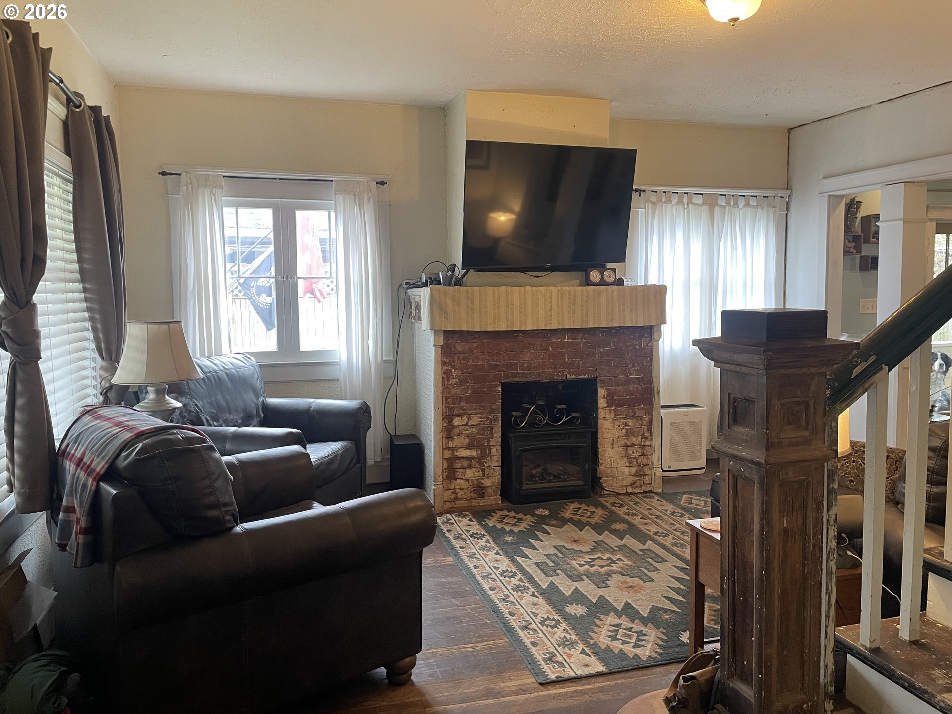 1006 5th Street Springfield, OR 97477 - Photo 3 of 43 a living room with furniture and a fireplace