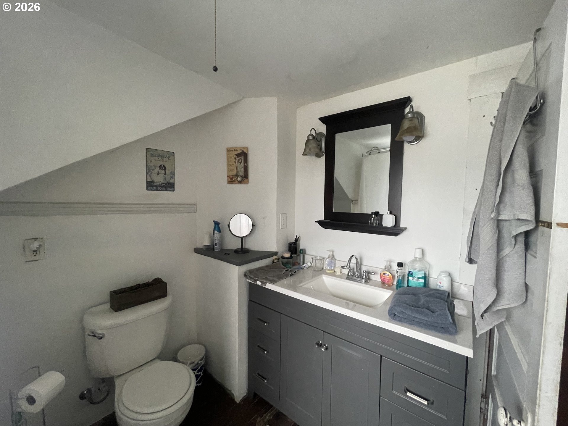 1006 5th Street Springfield, OR 97477 - Photo 36 of 43 a bathroom with a toilet sink and mirror
