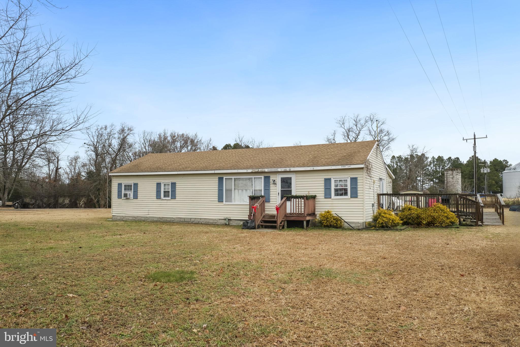 335 Bells Drive Warsaw, VA 22572 - Photo 11 of 11 a view of a house with a yard
