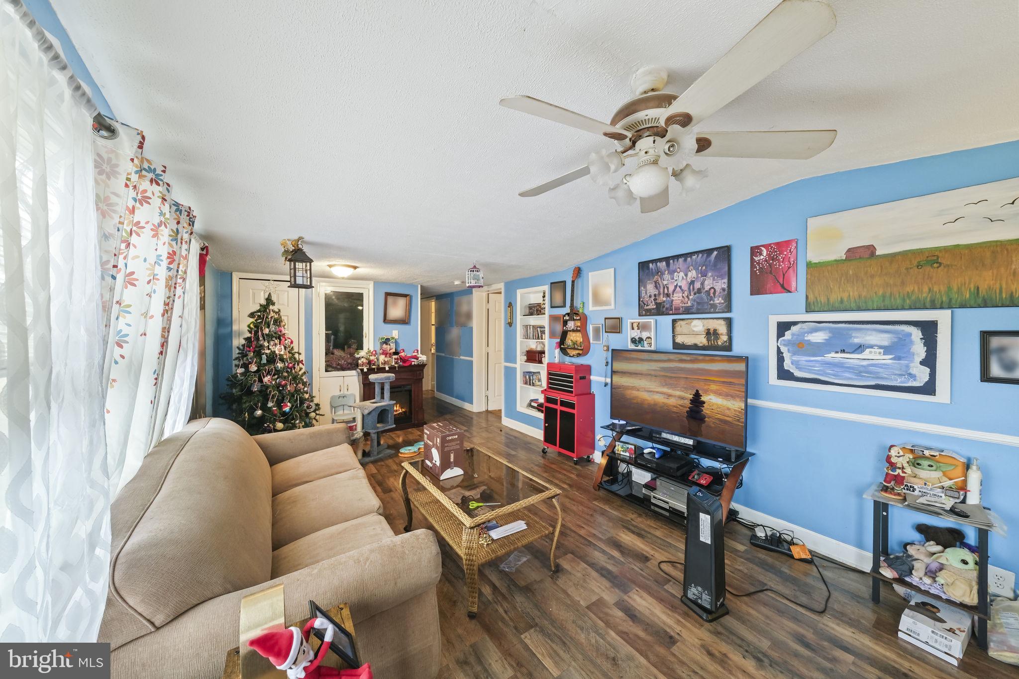 335 Bells Drive Warsaw, VA 22572 - Photo 5 of 11 a living room with furniture and wooden floor