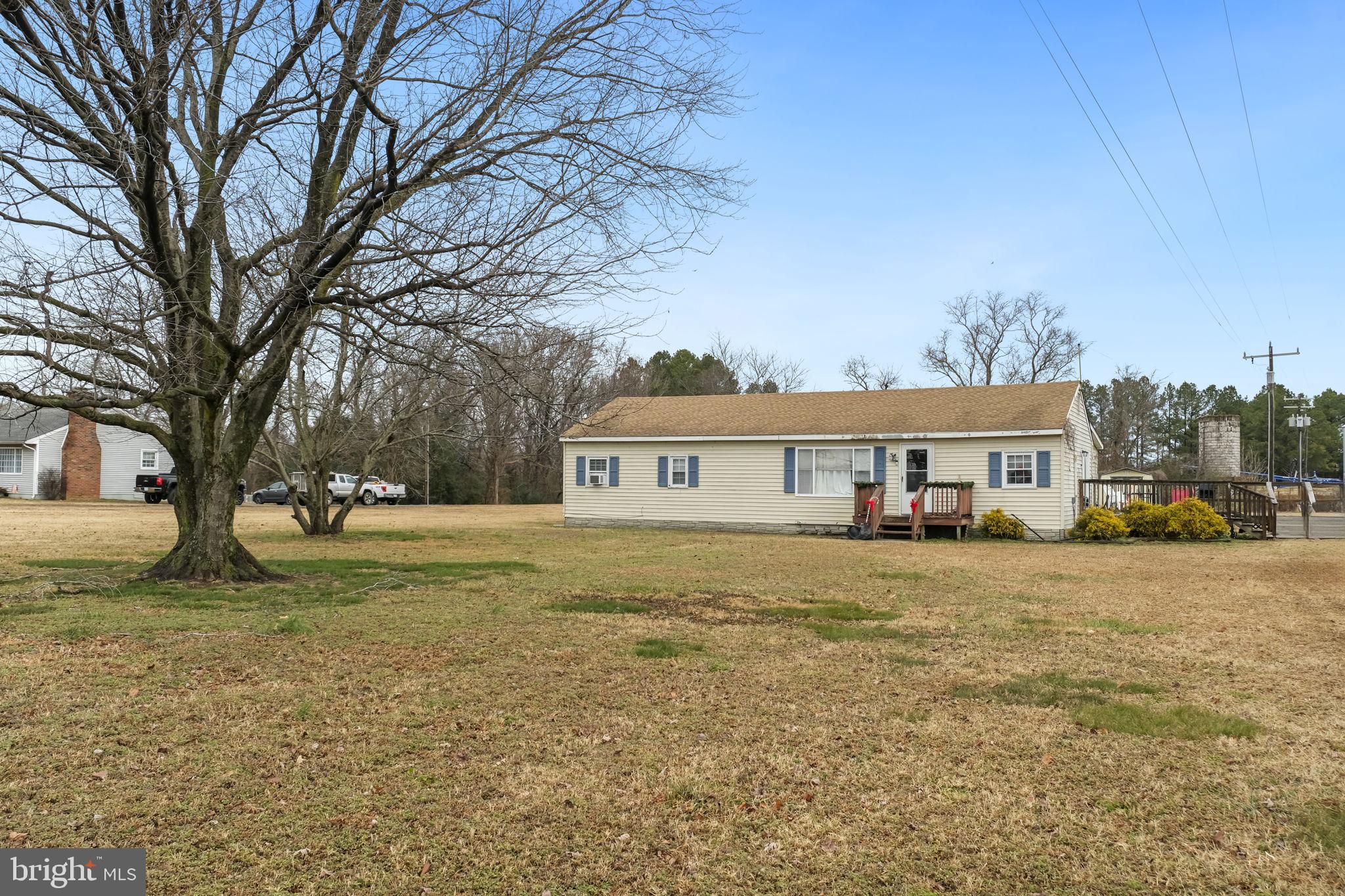 335 Bells Drive Warsaw, VA 22572 - Photo 7 of 11 a view of a house with a yard