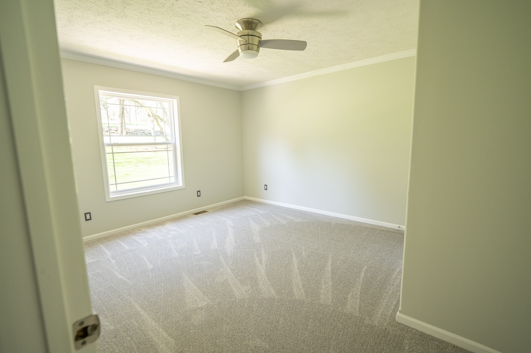 4081 South Commerce Road Watertown, TN 37184 - Photo 11 of 18 an empty room with windows and fan