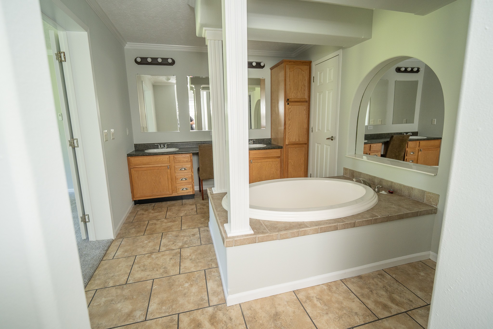 4081 South Commerce Road Watertown, TN 37184 - Photo 12 of 18 a bathroom with a granite countertop sink a mirror and a bathtub