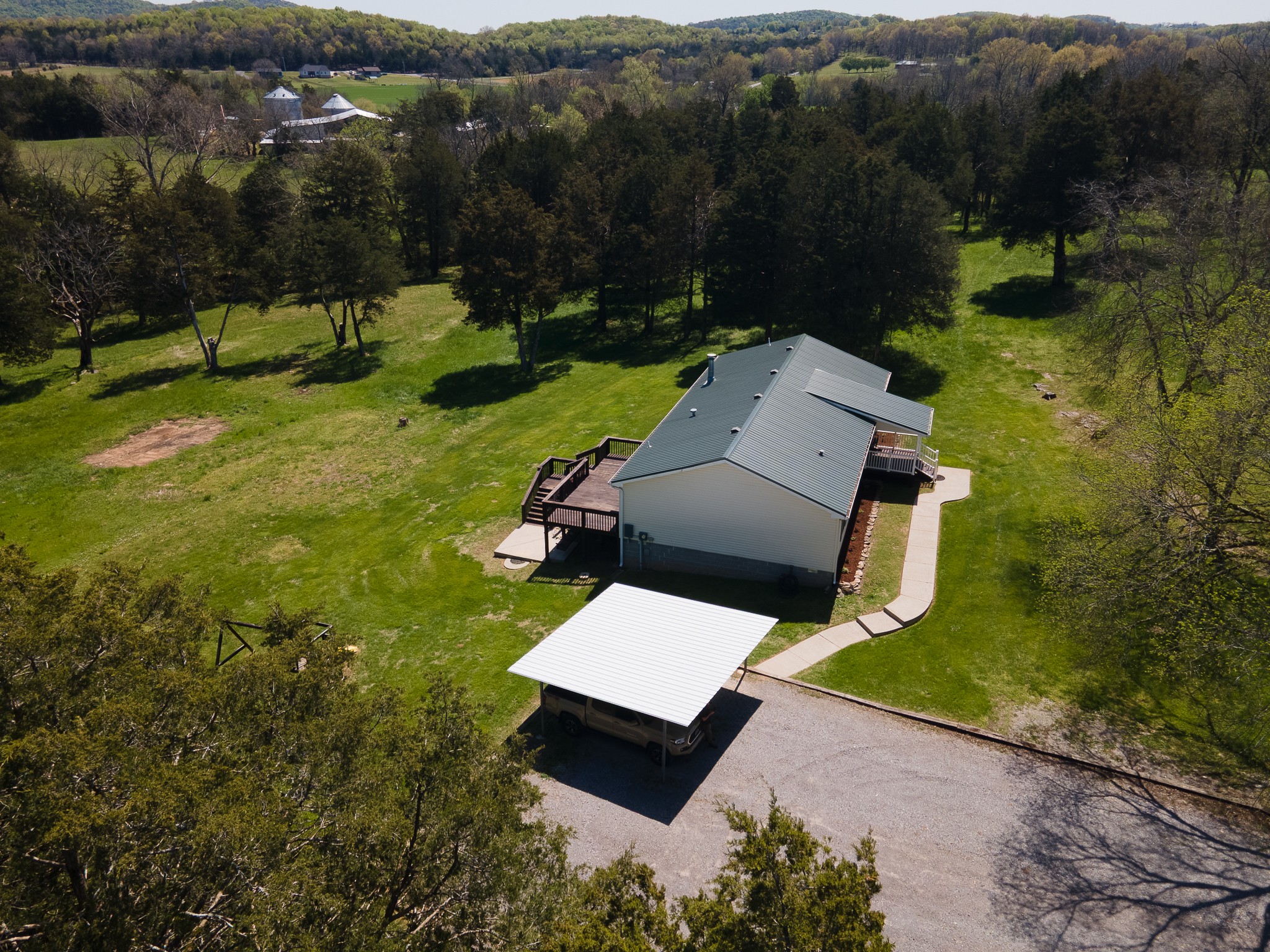 4081 South Commerce Road Watertown, TN 37184 - Photo 3 of 18 an aerial view of a house with garden space and street view