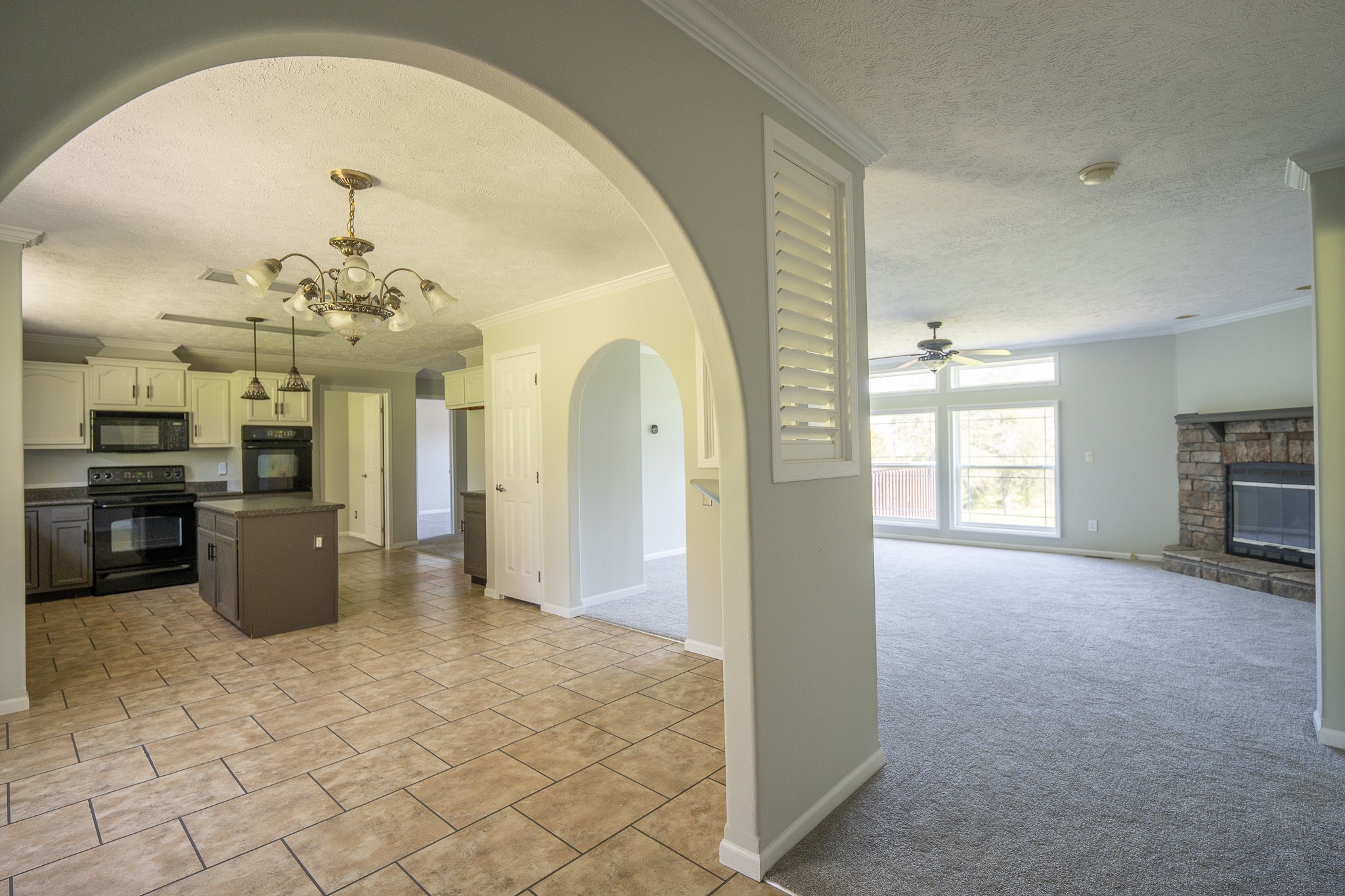 4081 South Commerce Road Watertown, TN 37184 - Photo 6 of 18 a view of a big room with windows and chandelier