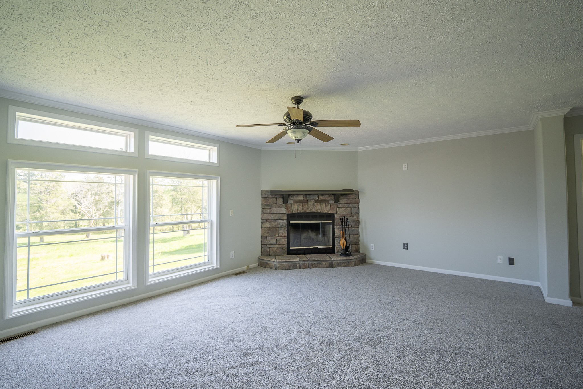 4081 South Commerce Road Watertown, TN 37184 - Photo 8 of 18 an empty room with windows and fireplace