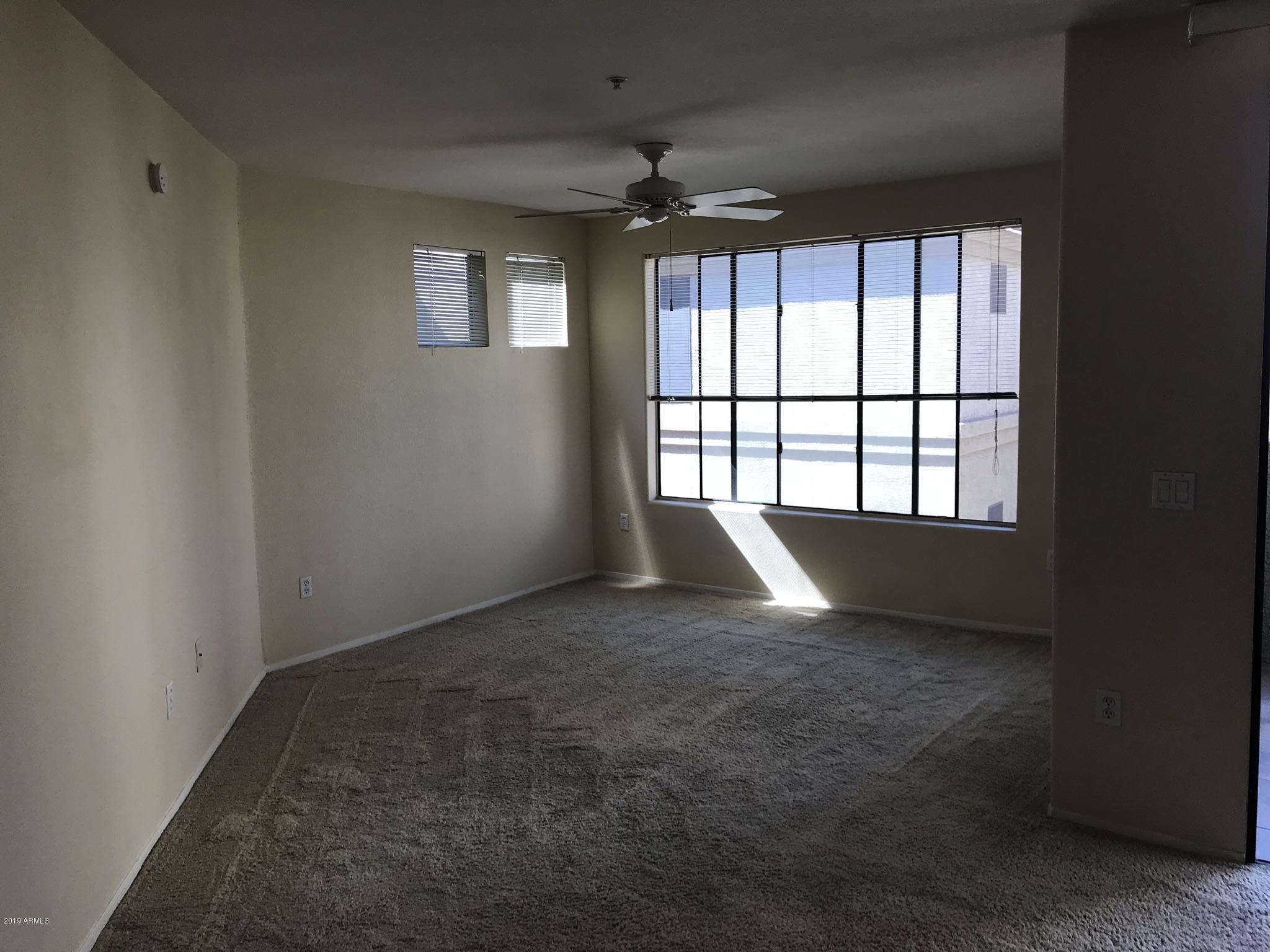3848 North 3rd Avenue, Unit 2046 Phoenix, AZ 85013 - Photo 17 of 25 an empty room with windows