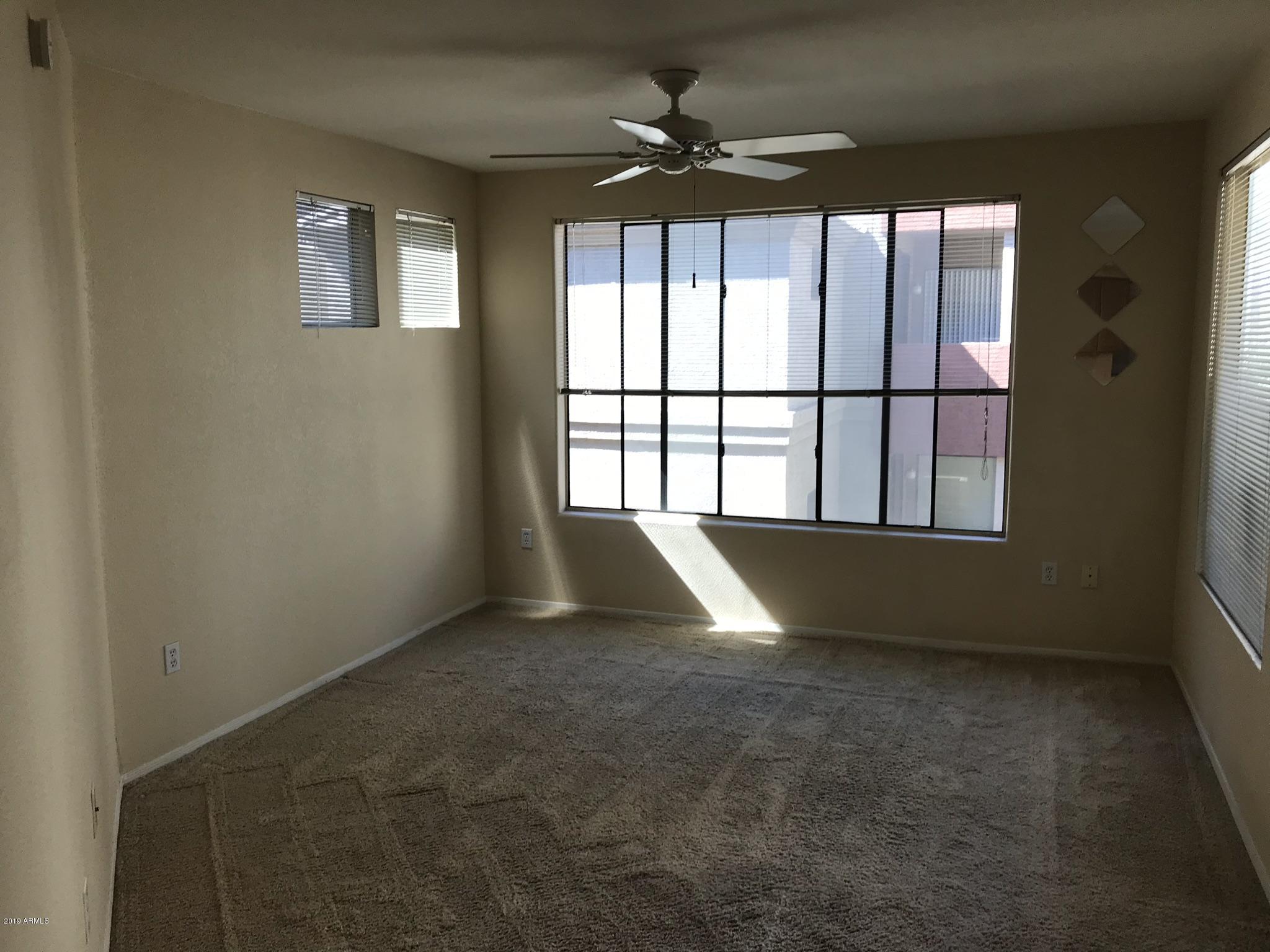 3848 North 3rd Avenue, Unit 2046 Phoenix, AZ 85013 - Photo 18 of 25 an empty room with windows