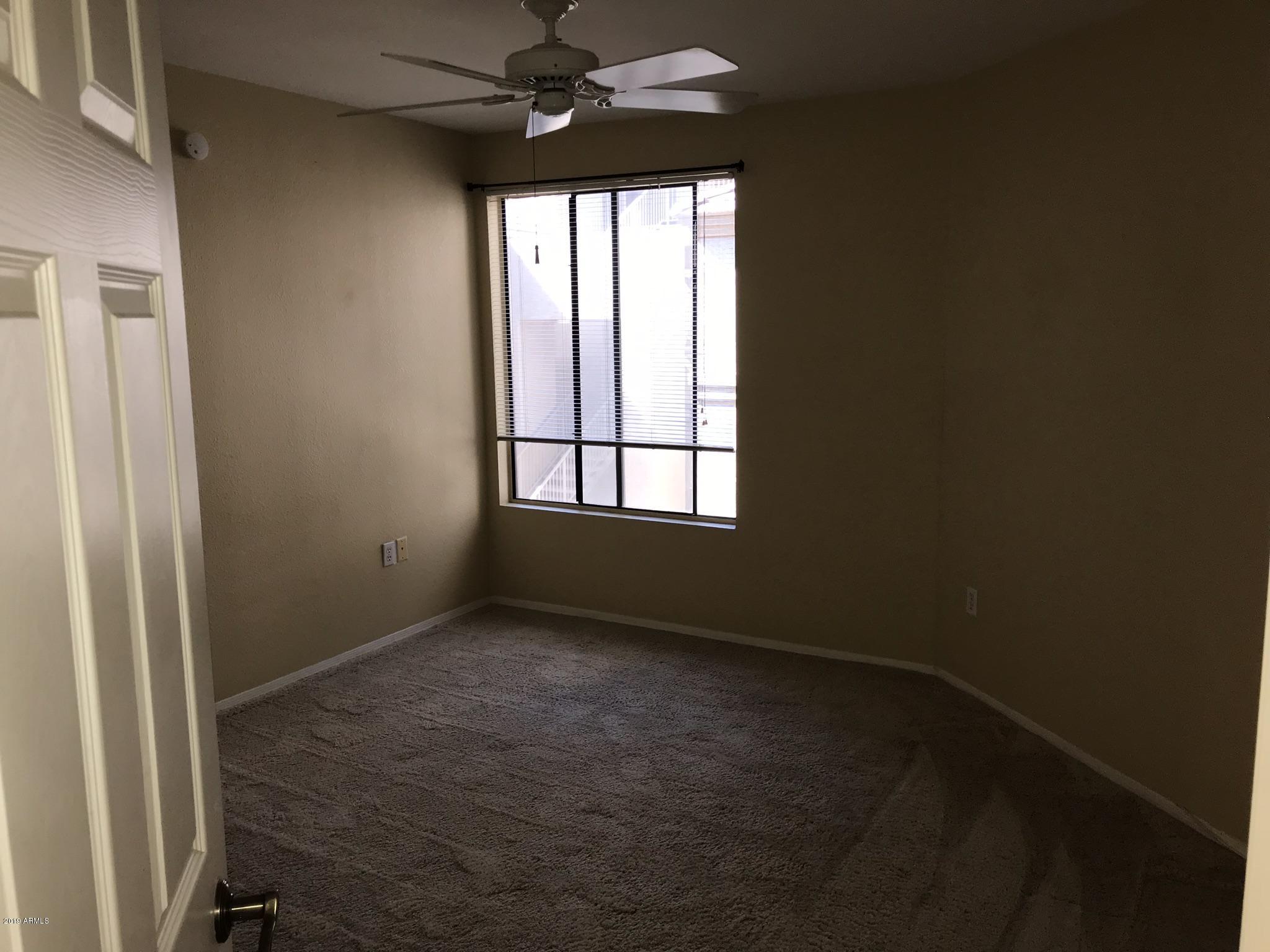 3848 North 3rd Avenue, Unit 2046 Phoenix, AZ 85013 - Photo 19 of 25 an empty room with a window