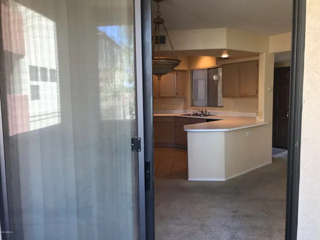 a view of a bathroom with a sink and mirror