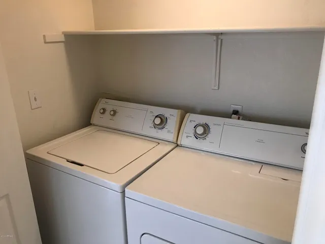 a utility room with dryer and washer