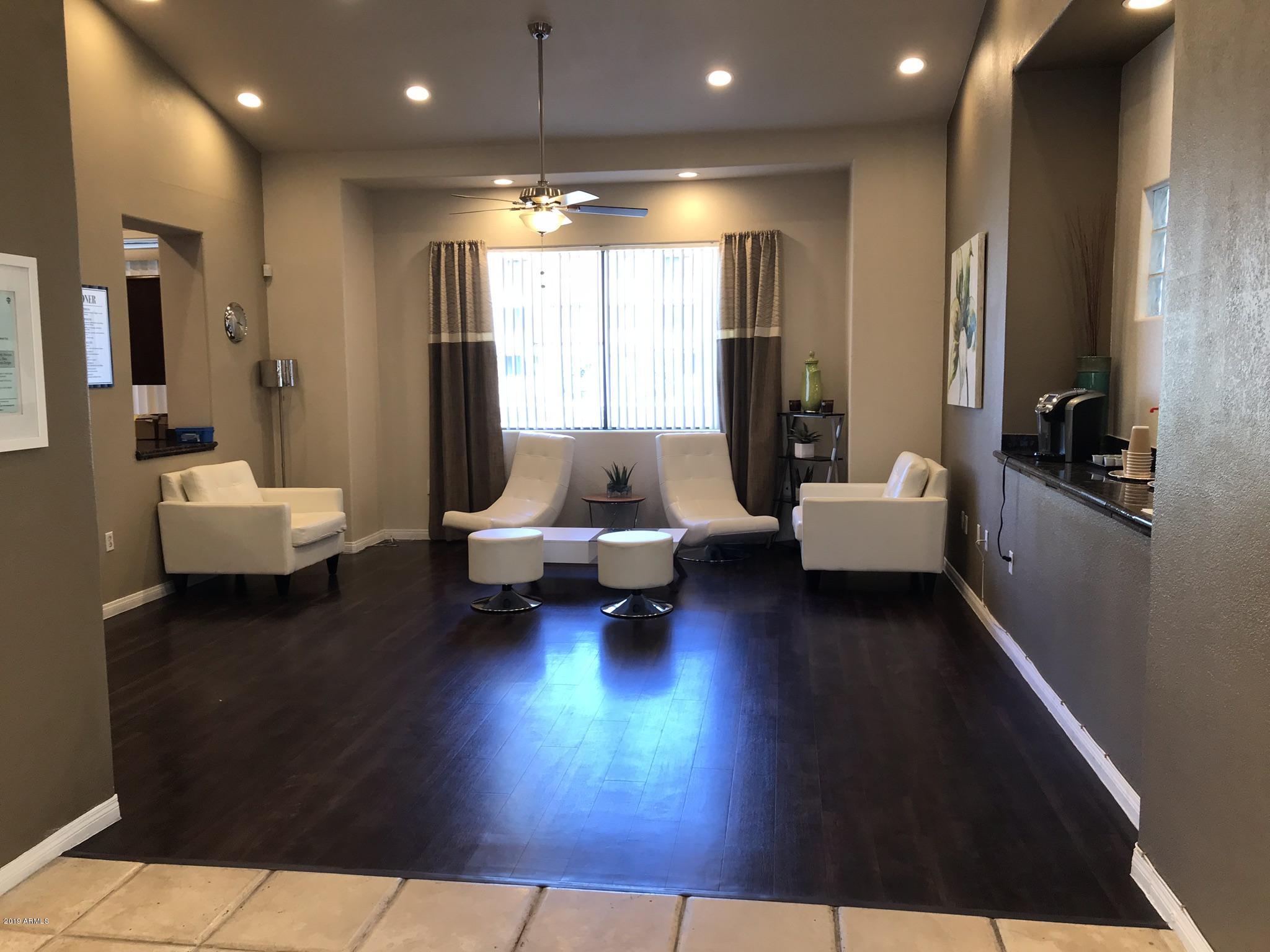 3848 North 3rd Avenue, Unit 2046 Phoenix, AZ 85013 - Photo 9 of 25 a living room with furniture and a couch