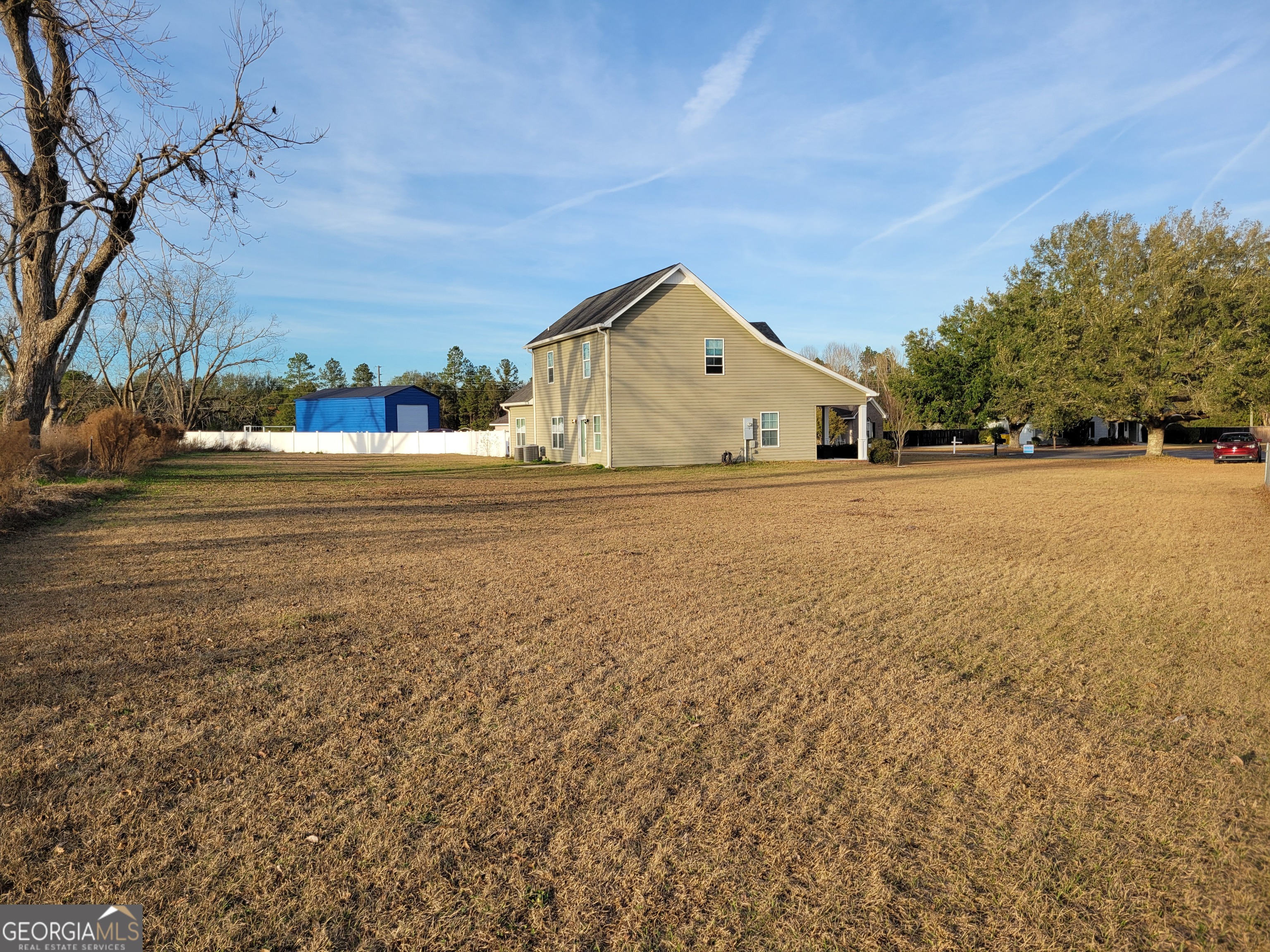 1615 Colony Lane Brooklet, GA 30415 - Photo 11 of 36 a big house with a big yard and large trees