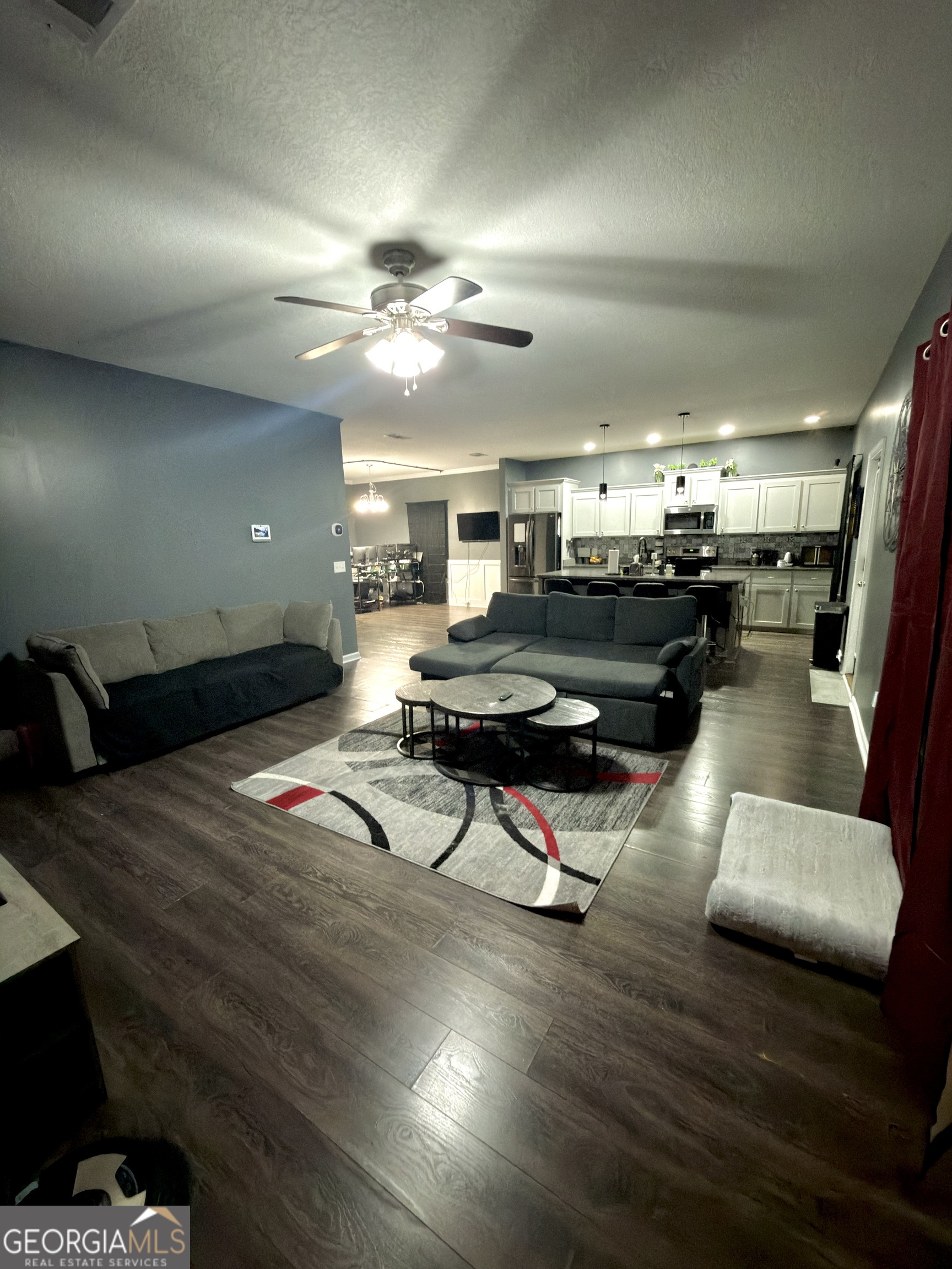 1615 Colony Lane Brooklet, GA 30415 - Photo 17 of 36 a living room with furniture gym equipment and a view of kitchen