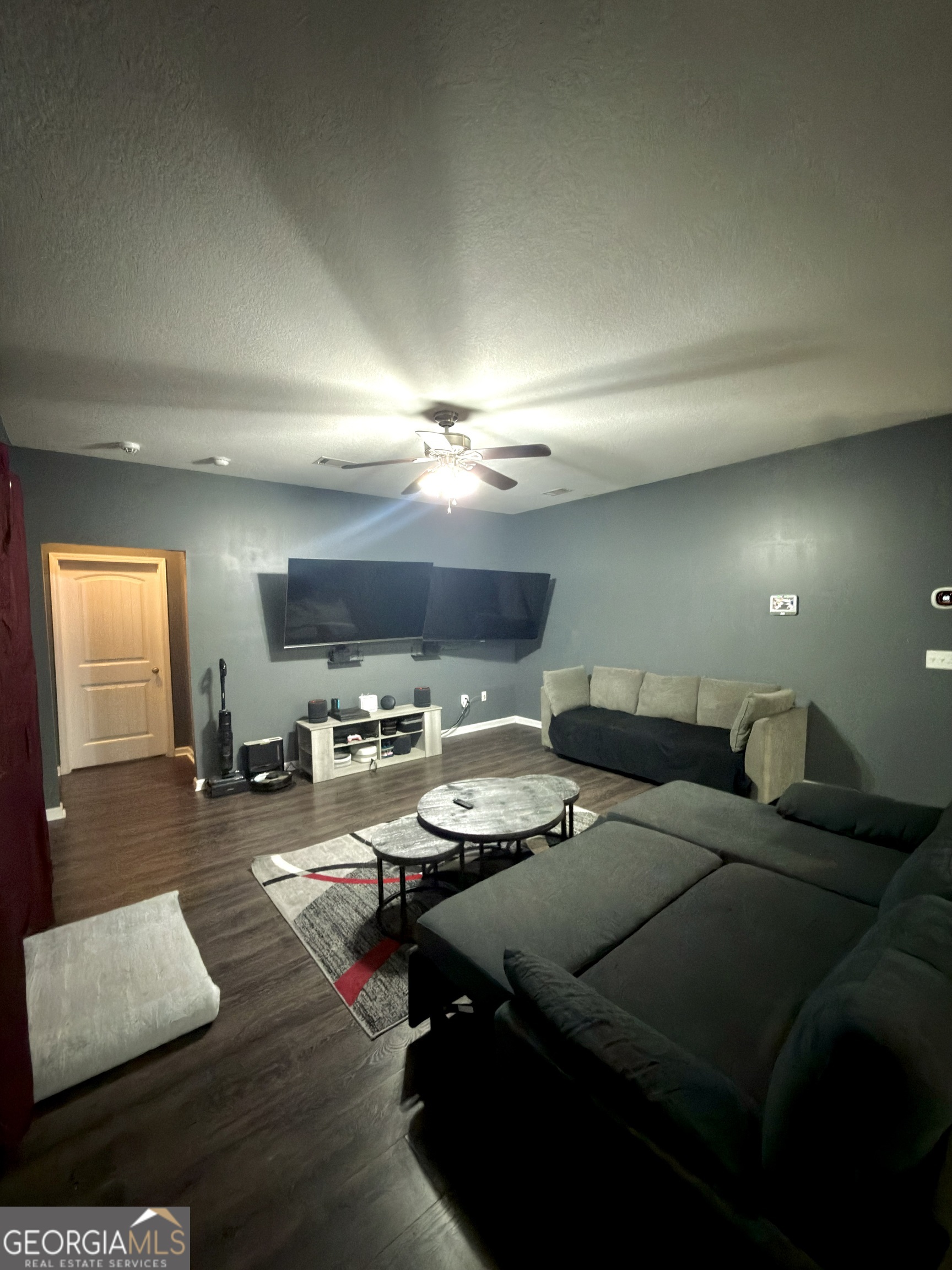 1615 Colony Lane Brooklet, GA 30415 - Photo 18 of 36 a living room with furniture and a flat screen tv