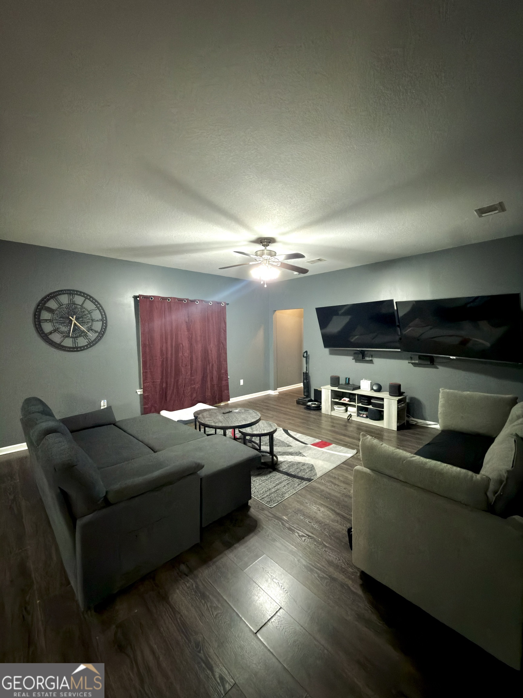 1615 Colony Lane Brooklet, GA 30415 - Photo 19 of 36 a living room with furniture and a flat screen tv