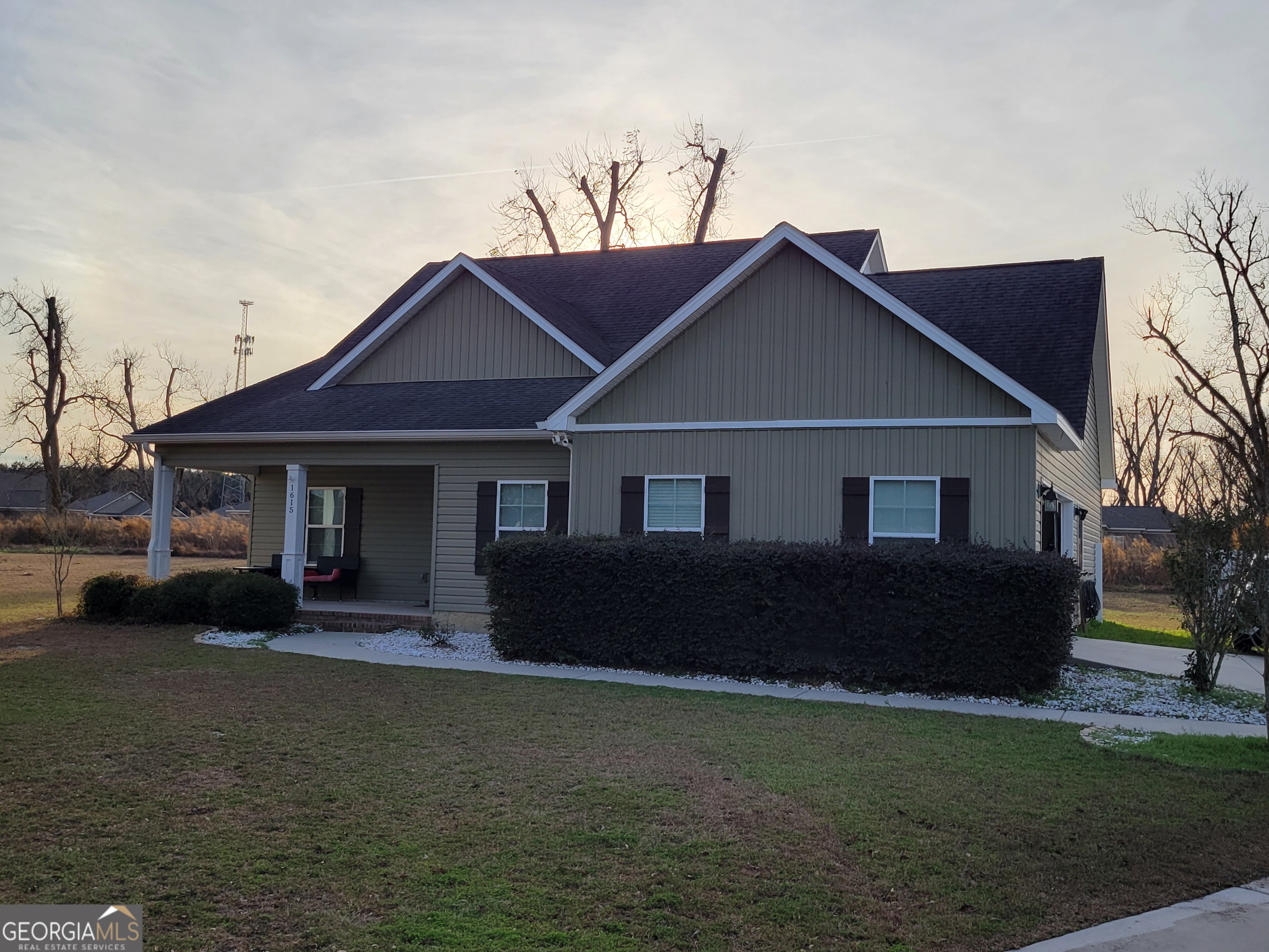 1615 Colony Lane Brooklet, GA 30415 - Photo 2 of 36 a front view of a house with a garden