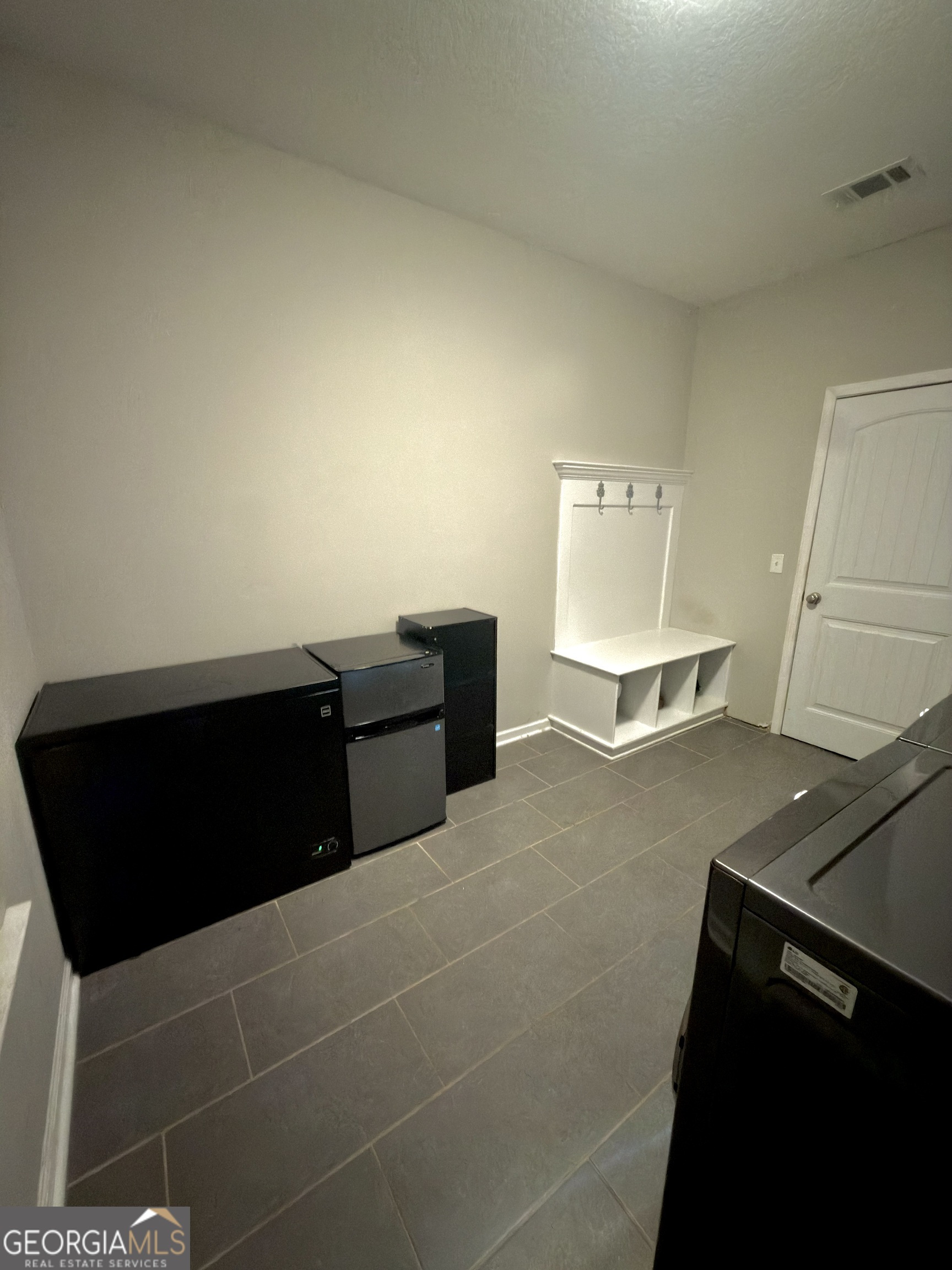 1615 Colony Lane Brooklet, GA 30415 - Photo 21 of 36 a living room with a bed