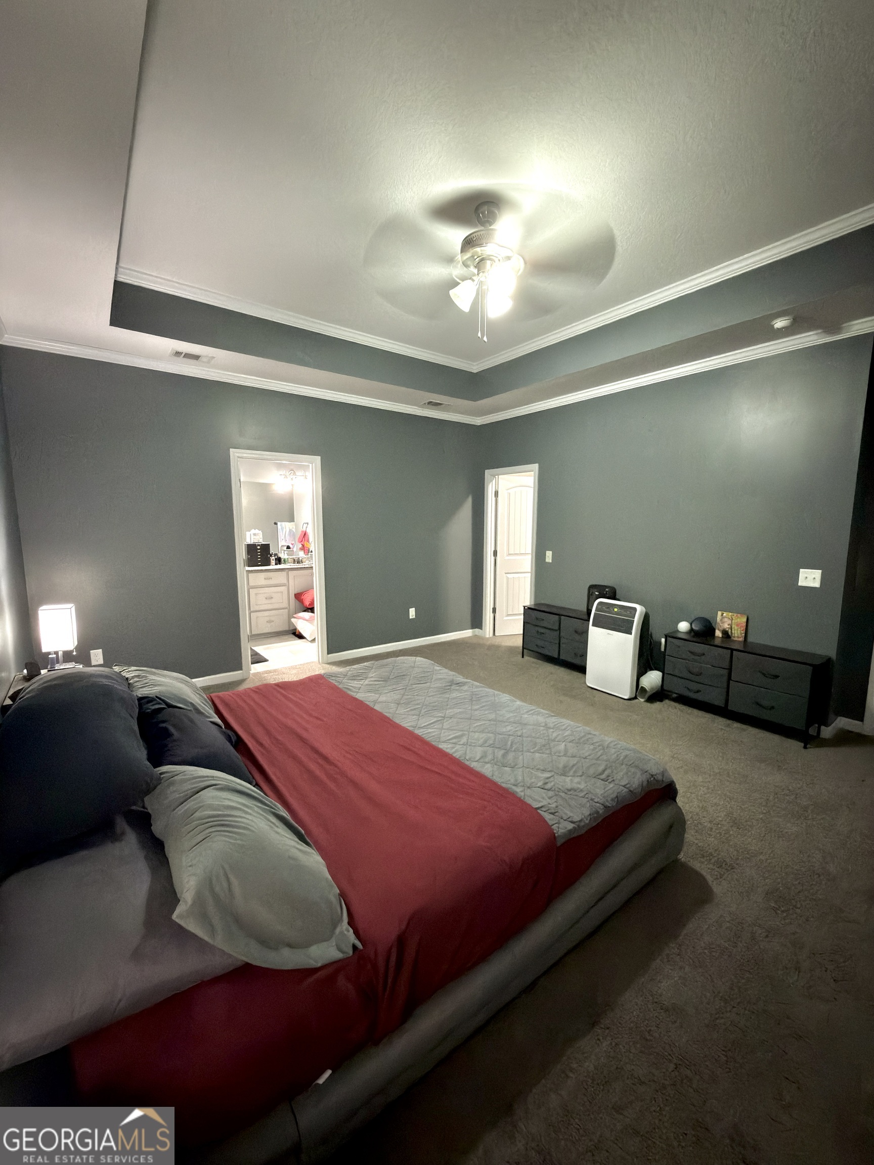 1615 Colony Lane Brooklet, GA 30415 - Photo 26 of 36 a bedroom with a bed and a mirror