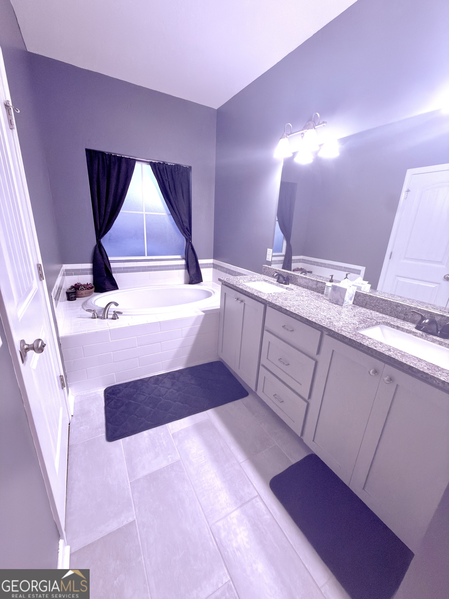 1615 Colony Lane Brooklet, GA 30415 - Photo 30 of 36 a bathroom with a sink and a mirror