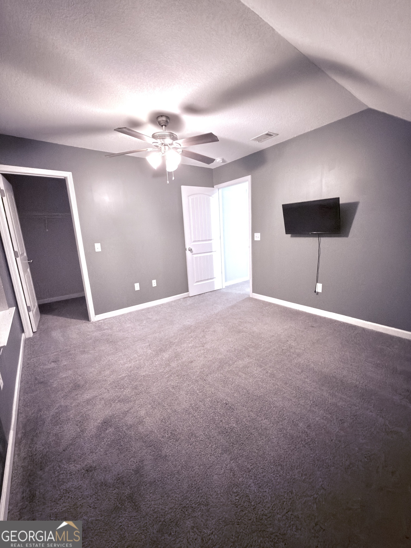 1615 Colony Lane Brooklet, GA 30415 - Photo 31 of 36 a view of a big room with windows and chandelier fan