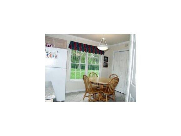 1220 Hanford Hills Road Graham, NC 27253 - Photo 11 of 24 a dinning table and chairs in a room