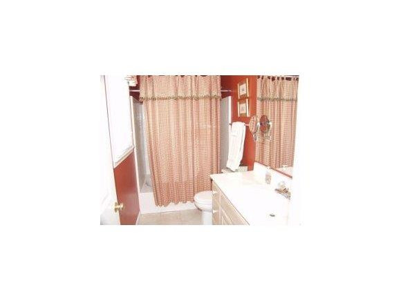 1220 Hanford Hills Road Graham, NC 27253 - Photo 15 of 24 a bathroom with a sink and a bathtub