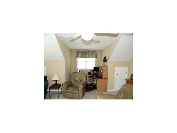 1220 Hanford Hills Road Graham, NC 27253 - Photo 19 of 24 a living room with couches and painted walls with kitchen