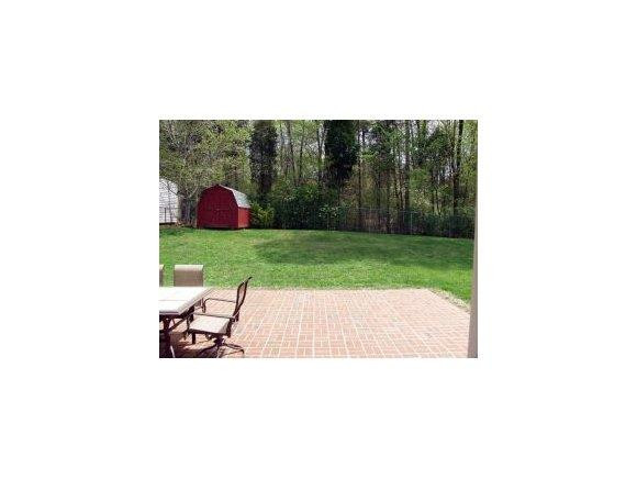 1220 Hanford Hills Road Graham, NC 27253 - Photo 23 of 24 a picture of a bench in a backyard