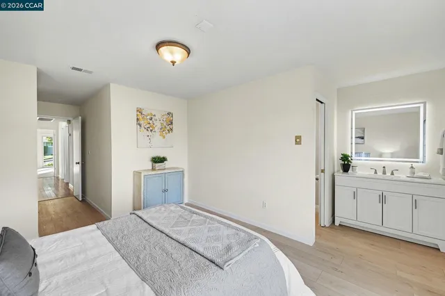 a bedroom with a bed and a cabinets